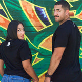 The back of the black Believe tee, showing the small mark between the shoulders